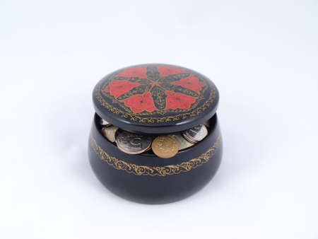  Round wooden casket with metal coinsの写真素材