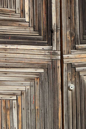 Fragment of the old wooden door close upの写真素材