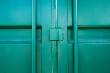 Close container door green color ready for transport in seaport/Close green containerの写真素材