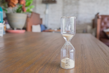 sandglass with decoration sandglass on table sandglass of five minute brown sandglass sandglass...