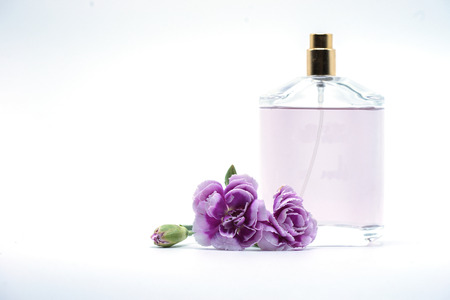 bouquet of purple white carnation flower and perfume bottle on isolated background text word on...
