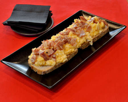 Toast with egg and serrano ham