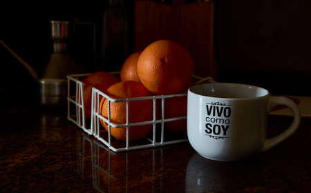 Breakfast with orange juice in a mug silk screened with live as I am