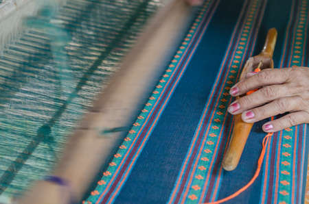 Woman weaving the cotton, Northeast of Thailandの写真素材