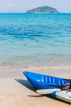 The emty blue kayak  on the beach ready for paddler.の写真素材