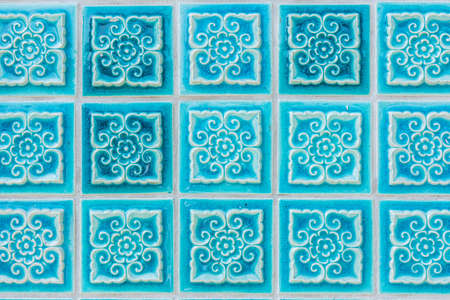 Pattern of turquoise flower glazed tiles. Abstract Background.の写真素材