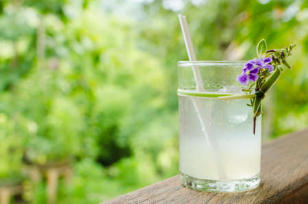 Cold fresh lemon juice on the wood rail.の写真素材