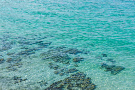 Landscape of beautiful turquoise clean water visible through submerged rock.の写真素材