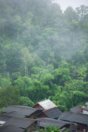 Northern of Thailand in the morning, the cottage with white roof in the middle of the village.の写真素材
