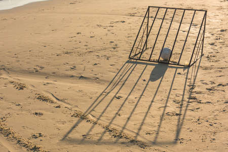 Ball with beach soccer goal in the evening. Suitable for use as wallpapers.の写真素材