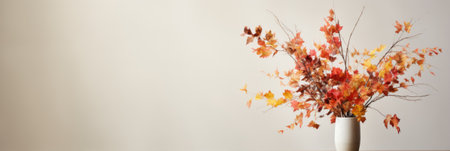 Vase with colorful autumn leaves on white background. Banner with copy spaceの素材