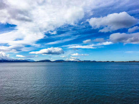 The beautiful Helgeland coast near the arctic circle border in Nordland county, Norway. The coast here is known for its steep mountains and islands, many of them are over 500-metres above sea level.の写真素材