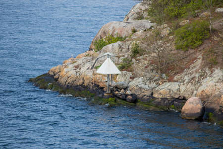 Sea mark/navigation sign in the Stockholm archipelago in Sweden.の写真素材