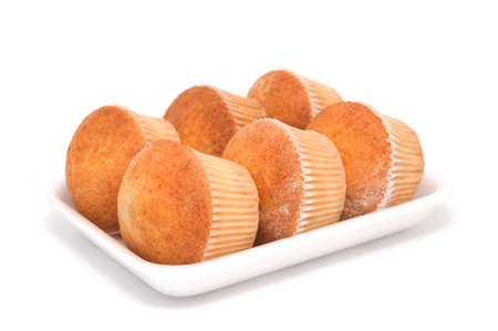 Tasty, fresh, bright fruitcakes on a tray. Isolated on a white background. A shade below.