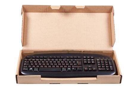The keyboard in a cardboard box isolated on a white background.の写真素材
