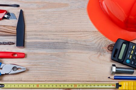 Set of construction tools on wooden board. Concept of building and repairing.