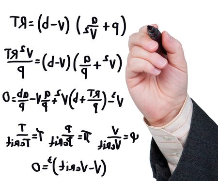 Hand with marker writing formulas and equations.