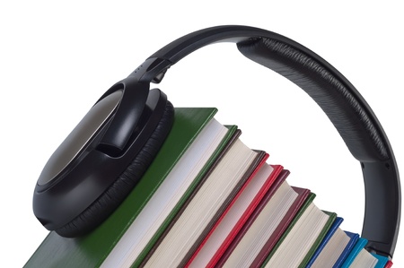 Headphones on books close up isolated white background. Concept e-learning and listening audiobooks.の写真素材