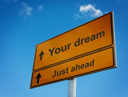 Your dream just ahead road sign. Concept of motivation and goals.の写真素材