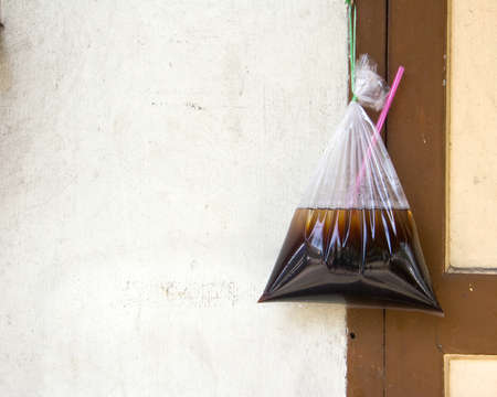 Unused water bag was hanging off the wall junk の写真素材