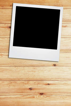 instant photo frame on old aged paper の写真素材