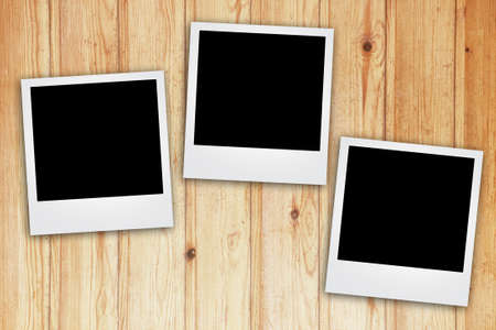 instant photo frame on old aged paper の写真素材