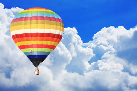 colorful hot air balloon on nice cloudy blue sky の写真素材
