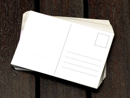 blank postcards on wooden tableの写真素材