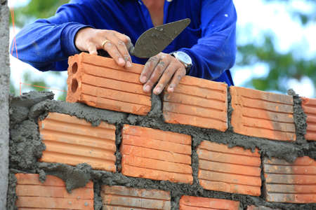 A construction worker working with concrete wall, の写真素材