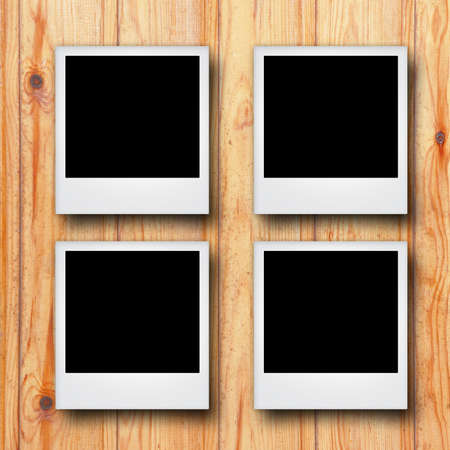 blank photo frame on wooden background.の写真素材