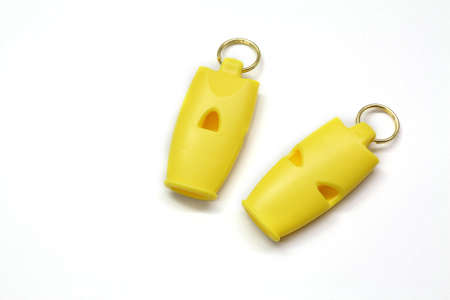 yellow whistle isolated white の写真素材