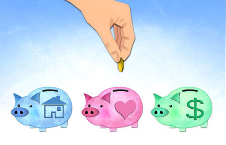 hand putting coin to healthy piggy bank の写真素材