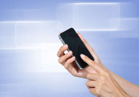 Hand touch screen to smart phone with blue-violet icons background 