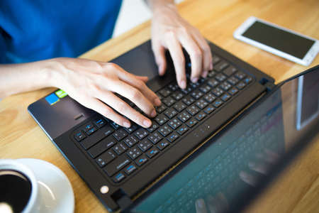 Female hand typing keyboard.の写真素材