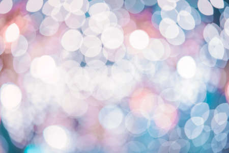 Holiday glowing Abstract Glitter Defocused Background with Blurred Blue color Bokeh.の写真素材