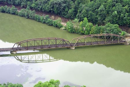Old bridge across the riverの写真素材