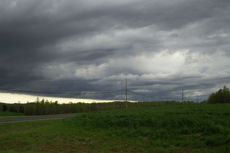 Ominous dark storm clouds over the landscapeの写真素材