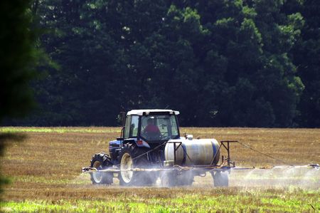 A farmer prepping his field for plantingの写真素材