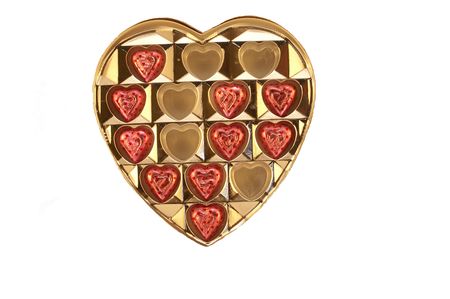 A box with chocolate candy hearts on a white backgroundの写真素材
