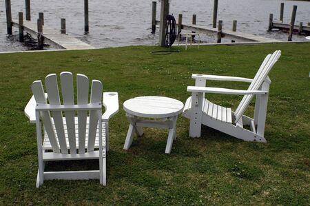 Chairs and table looking out on the ocean.の写真素材