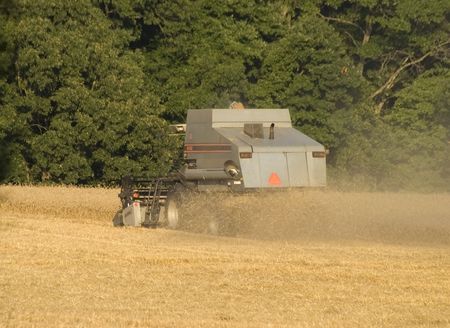 A farmer harvesting his fieldの写真素材