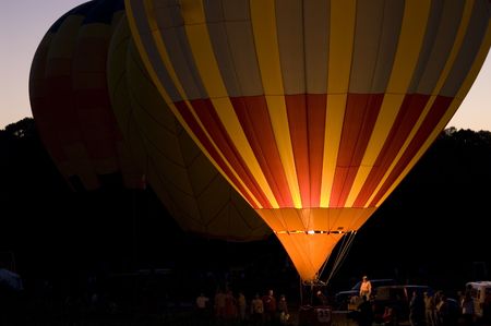 An image of a single balloon glowing at night.の写真素材