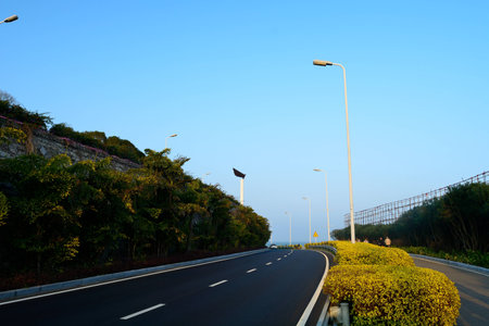Asphalt road under the blue sky