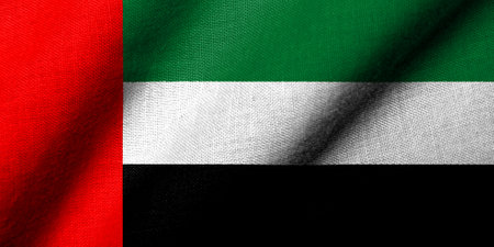 Realistic 3D Flag of the United Arab Emirates with fabric texture wavingの写真素材