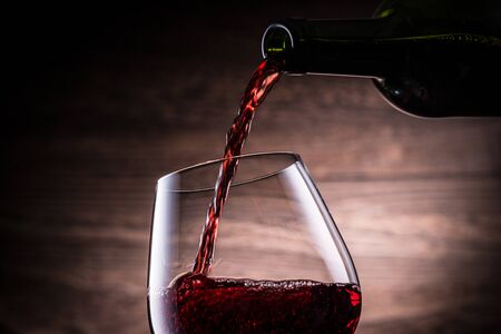 Pour the red wineの写真素材