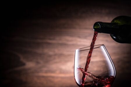 Pour the red wineの写真素材