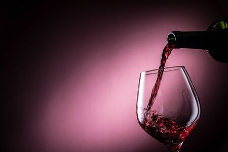 Pour the red wineの写真素材