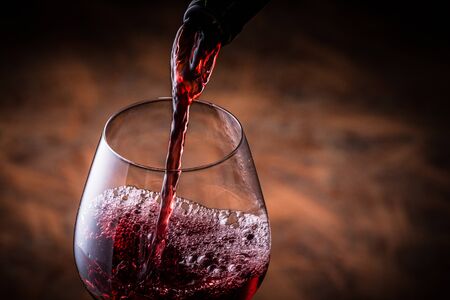 Pour the red wineの写真素材