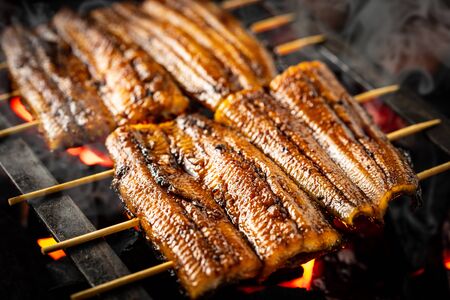 Baking eels at an eel restaurant in Japanの写真素材