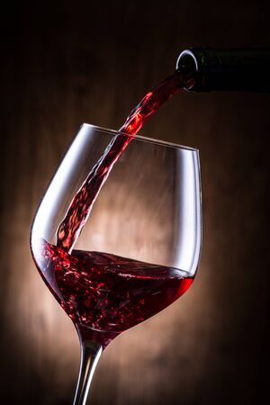 Pour the red wineの写真素材